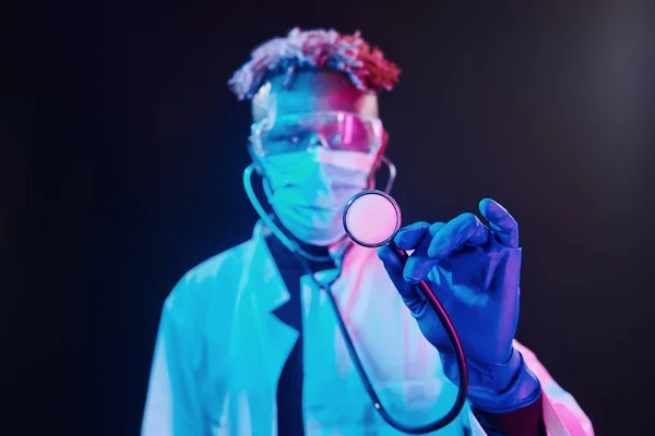 Smart Doctor Protective Uniform Holding Stethoscope Futuristic Neon Lighting Young — Stock fotografie