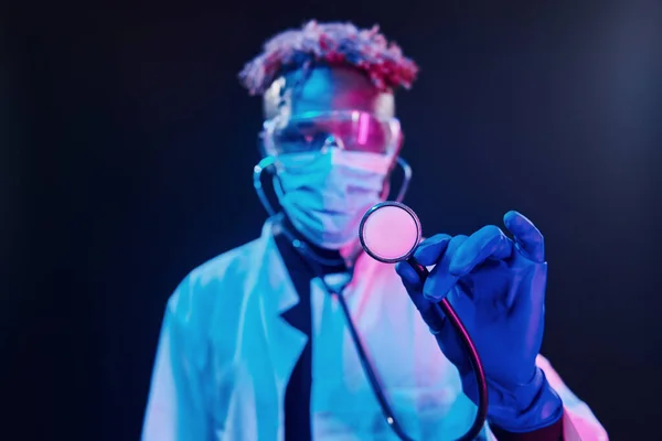 Smart Doctor Protective Uniform Holding Stethoscope Futuristic Neon Lighting Young — Zdjęcie stockowe