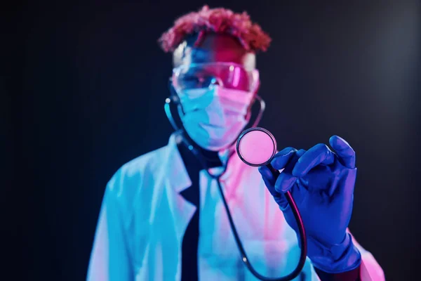 Smart Doctor Protective Uniform Holding Stethoscope Futuristic Neon Lighting Young — Stock fotografie