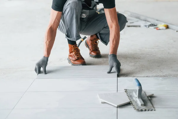 Man Grey Uniform Works Indoors Modern Big Office Daytime — Stock Photo, Image