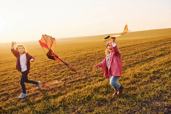 Two Little Girls Friends Have Fun Together Kite Toy Plane — Fotografia de Stock