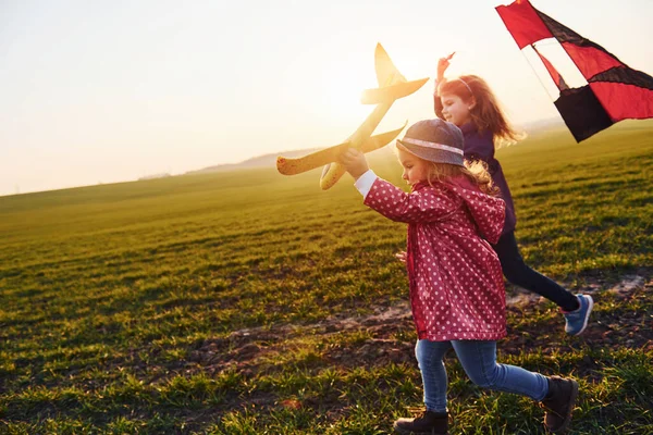 Two Little Girls Friends Have Fun Together Kite Toy Plane — Stock Photo, Image