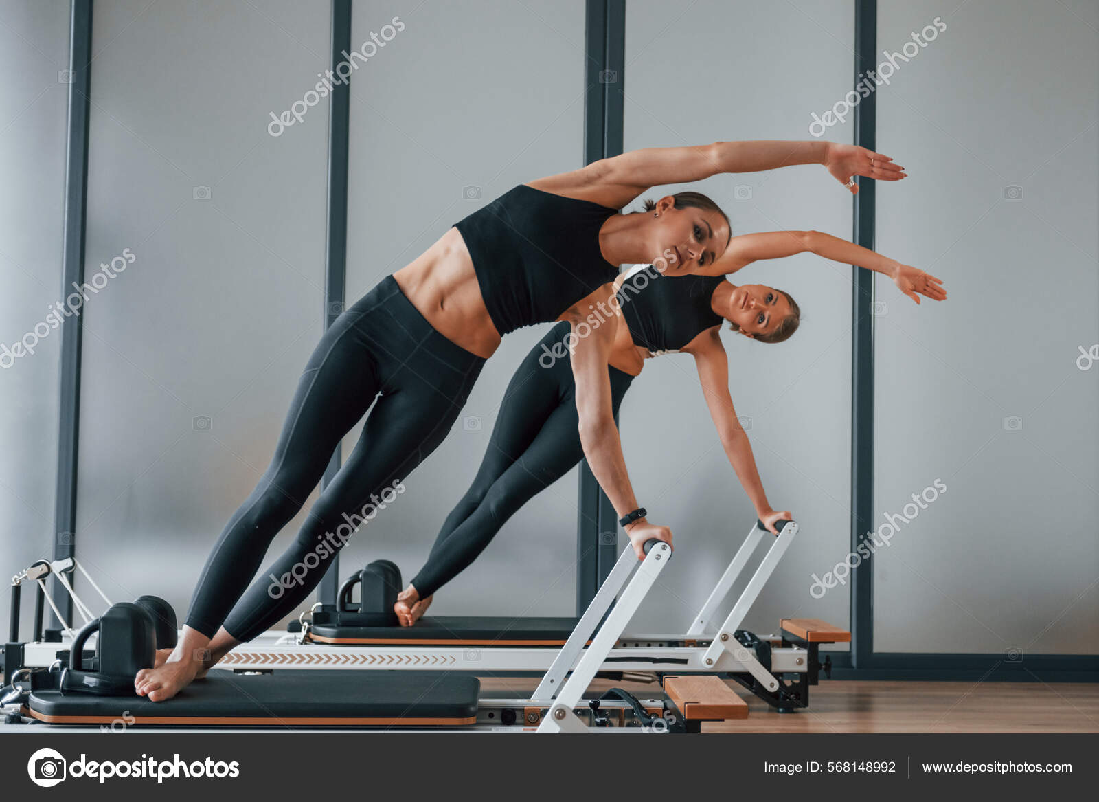 Premium Photo  Standing on gym equipment and doing stretches two
