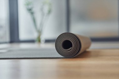 Close up detailed view of fitness mat that lying down on the floor.