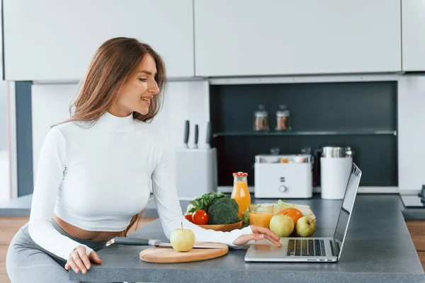 Uses Laptop Young European Woman Indoors Kitchen Indoors Healthy Food — 스톡 사진