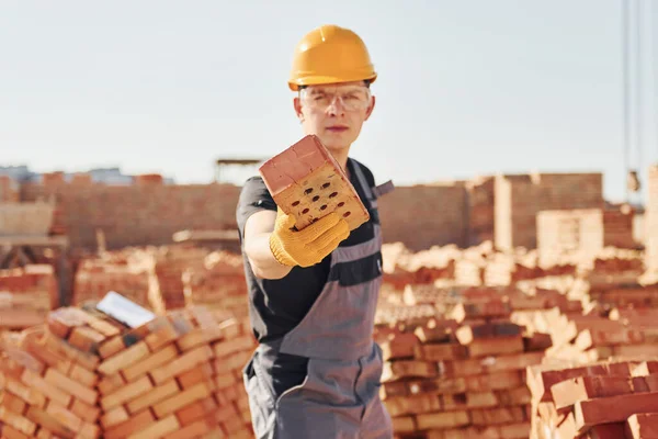 Holds Brick Hand Construction Worker Uniform Safety Equipment Have Job — Stock fotografie