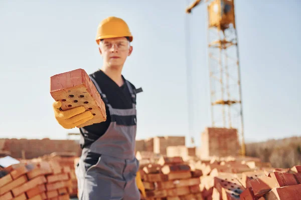 Holds Brick Hand Construction Worker Uniform Safety Equipment Have Job — Stock fotografie