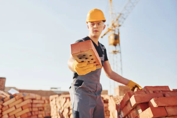 Holds Brick Hand Construction Worker Uniform Safety Equipment Have Job — Fotografia de Stock