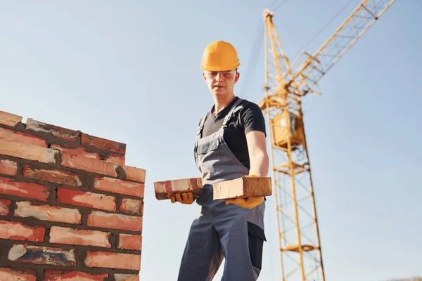 Holds Bricks Hands Construction Worker Uniform Safety Equipment Have Job — Fotografia de Stock