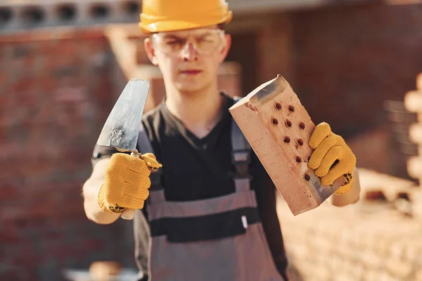 Portrait Construction Worker Uniform Safety Equipment Standing Building Holding Brick — 스톡 사진