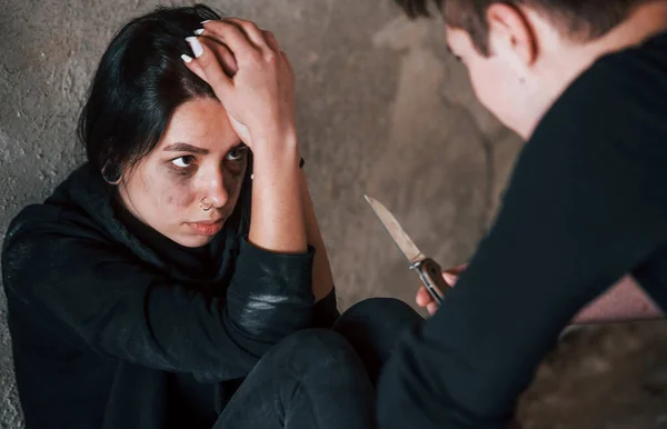 Kidnapped Woman Sitting Threatened Man Knife Hands Abandoned Building — Stock Photo, Image