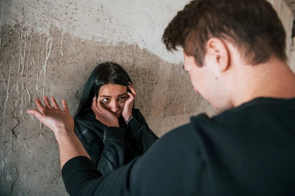 Kidnapped Woman Standing Wall Threatened Man Abandoned Building — Stock Photo, Image