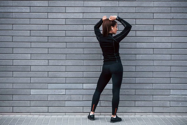Rear View Young Sportive Girl Black Sportswear Standing Outdoors Gray — Stockfoto
