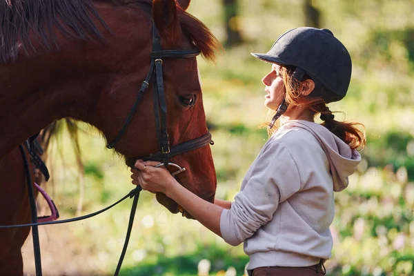 Young Woman Protective Hat Her Horse Forest Sunny Daytime — Stock Fotó