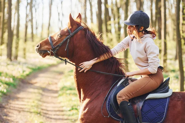 Young Woman Protective Hat Her Horse Forest Sunny Daytime —  Fotos de Stock