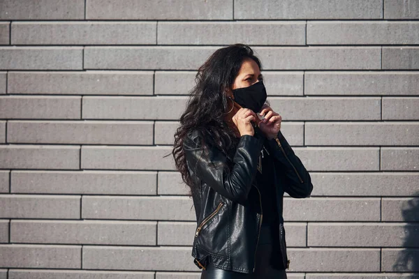 Protective Mask Beautiful Brunette Curly Hair Black Clothes Outdoors Wall — Stok fotoğraf
