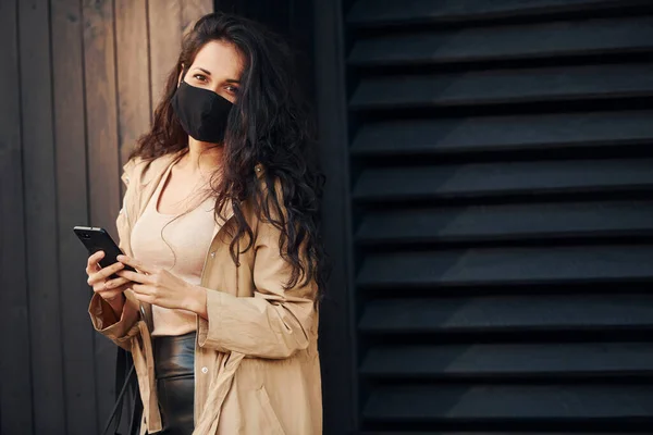 Protective Mask Woman Black Curly Hair Standing Black Wooden Building — Foto de Stock