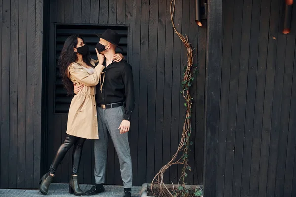 Woman Black Curly Hair Standing Black Wooden Building Exterior Her — Foto Stock