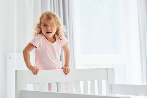 Standing Bed Cute Little Girl Casual Clothes Indoors Home Daytime — Stock Photo, Image