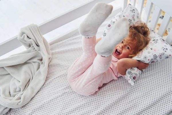 Lying Bed Cute Little Girl Casual Clothes Indoors Home Daytime — Stock Photo, Image