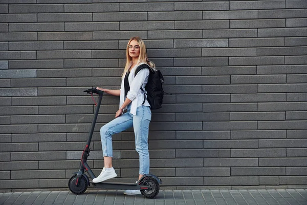 Side View Beautiful Blonde Casual Clothes Riding Electric Schooter Outdoors — Fotografia de Stock