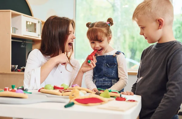 Young Woman Little Boy Girl Playing Toys Together Kitchen — Stock Photo, Image