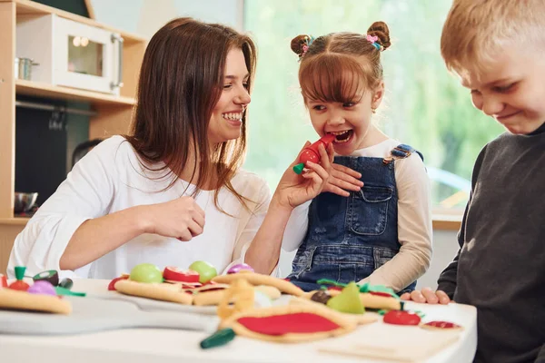 Young Woman Little Boy Girl Playing Toys Together Kitchen — Stock Photo, Image