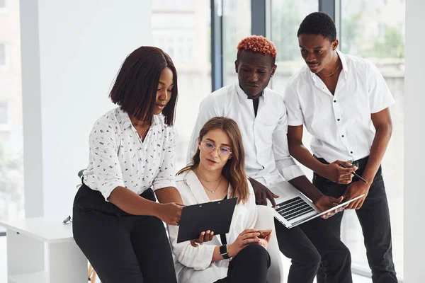 Group of african american business people working in office together.