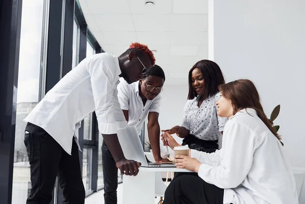 Group of african american business people working in office together.