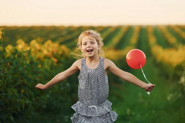 Positive Little Girl Red Balloon Hands Have Fun Field Summer — Stock Photo, Image