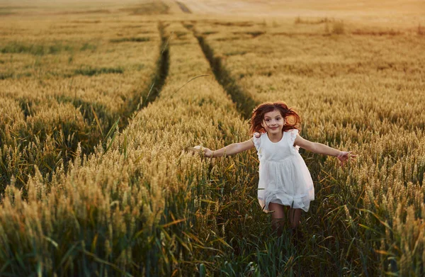 Cheerful Little Girl White Dress Running Agricultural Field Summer Day — Stock Photo, Image