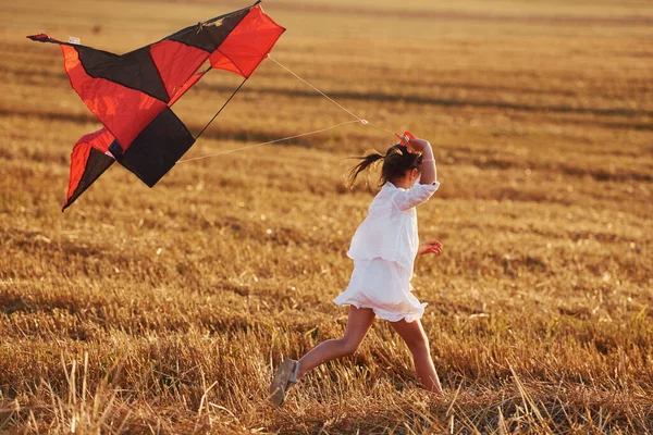 Happy Little Girl Running Red Kite Outdoors Field Summertime — Stock Photo, Image