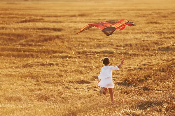 Happy Little Girl Running Red Kite Outdoors Field Summertime — Stock Photo, Image