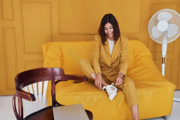 Woman Sits Indoors Orange Colored Room Same Colored Clothes — Stock Photo, Image