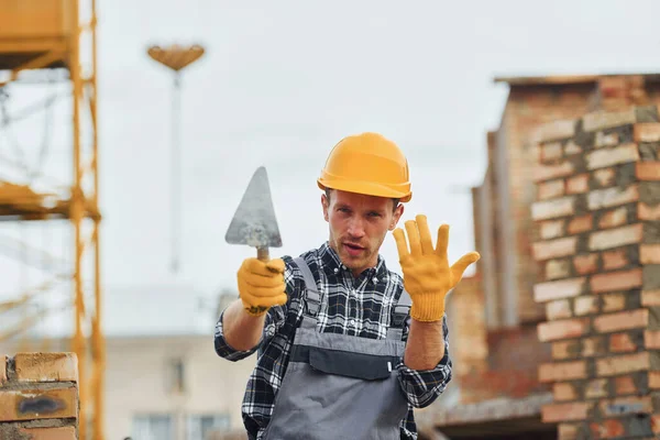 Holds Spatula Construction Worker Uniform Safety Equipment Have Job Building — Stock Photo, Image