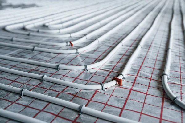 Pipes of underfloor heating system. Close up view. No people.