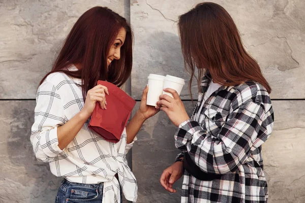 Holds Red Package Coffee Beautiful Cheerful Friends Lesbian Couple Together — Stock Photo, Image