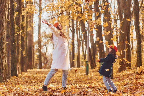 Throwing Leaves Air Mother Her Little Daughter Having Walk Autumn — Stock Photo, Image