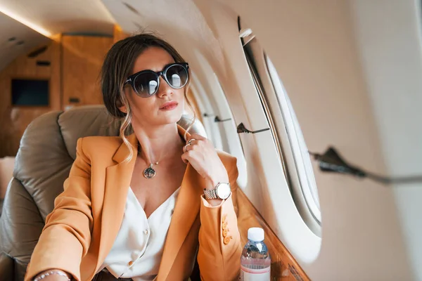 Sunglasses Young Passenger Woman Yellow Clothes Flying Plane — Stock Photo, Image