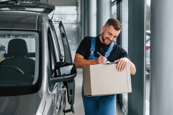 Paper Box Delivery Man Uniform Indoors Car Order — Stock Photo, Image