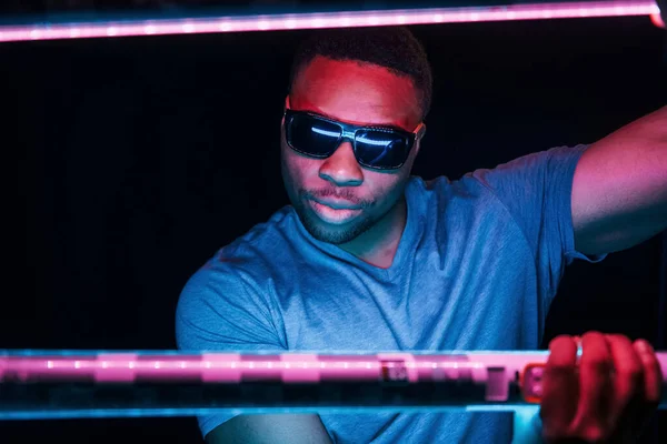Sunglasses Futuristic Neon Lighting Young African American Man Studio — Stock Photo, Image