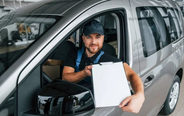 Sitting Vehicle Holding Document Delivery Man Uniform Indoors Car Order — Stock Photo, Image