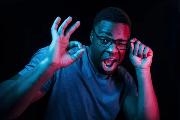 Facial Expression Futuristic Neon Lighting Young African American Man Studio — Stock Photo, Image