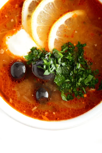 Fresh soup with sauce and lemon — Stock Photo, Image