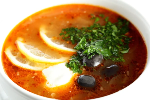 Fresh soup with sauce and lemon — Stock Photo, Image