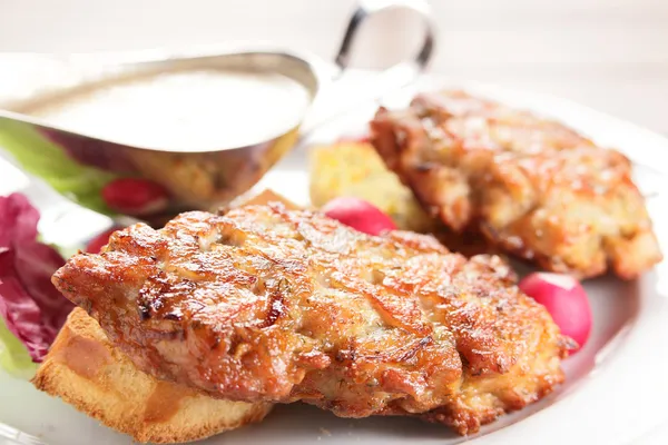 Peaces of meat with garnish — Stock Photo, Image