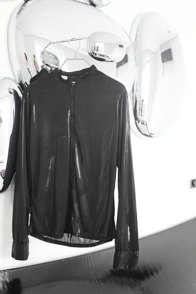 Black shirt on white and glossy background — Stock Photo, Image
