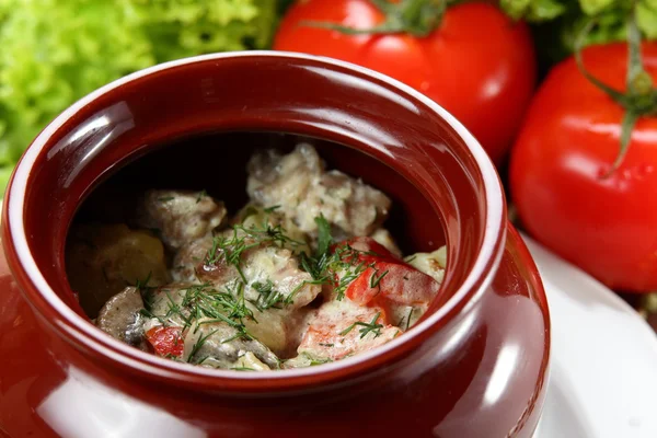black pot with meat and potato