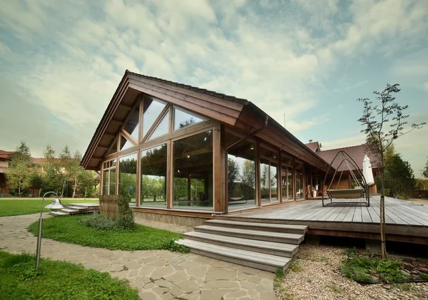 Exterior of wooden house with swimming pool — Stock Photo, Image