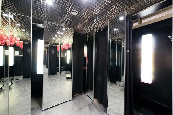 Interior of dressing room at cloth store — Stock Photo, Image